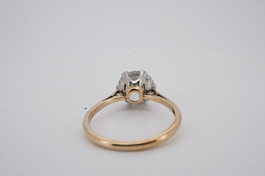 A yellow metal (stamped '9ct sil') and single stone white zircon set ring, gross weight 2.9 grams. Condition - poor to fair